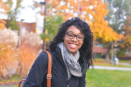 Smiling girl on the SFCC campus.